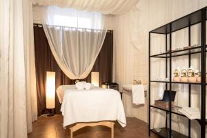 Postel nebo postele na pokoji v ubytování Hotel Litovel