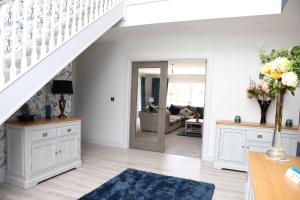 a living room with a staircase and a living room at Willoughby House in Cork