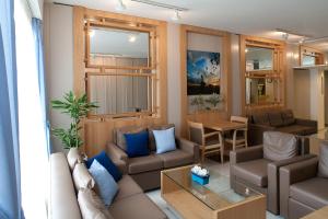 a living room with a couch and a table at Hotel Hermes in Rhodes Town