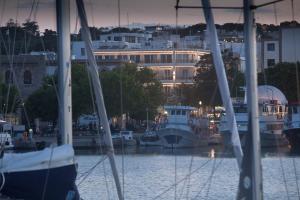 a group of boats docked in a marina at night at Hotel Hermes in Rhodes Town