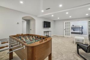 a room with a foosball table in the middle at NEW Modern 5BR House in Monument Near USAFA, Park in Monument