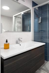 a bathroom with a sink and a mirror at Appartamento Campagnola Mansardato in Riva del Garda