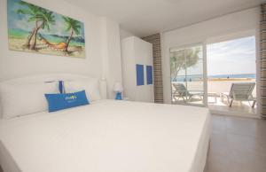 Кровать или кровати в номере MOJO OTEL BEACH