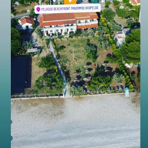 an aerial view of a resort next to a body of water at Pelagos Beachfront in Panormos Skopelos