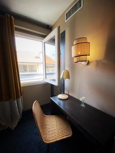 Cama ou camas em um quarto em Hotel Molière