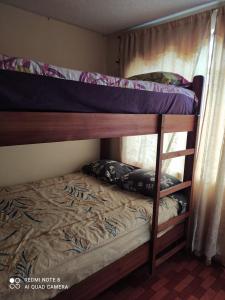 Una cama o camas cuchetas en una habitación  de La casa de Panda