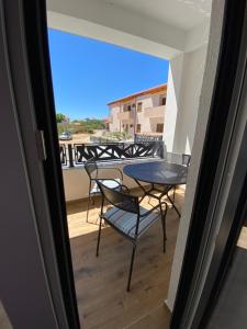 a view of a balcony with a table and chairs at Holiday house Aria di Mare in Starigrad-Paklenica