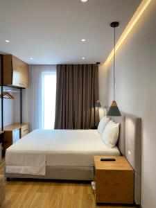 Postel nebo postele na pokoji v ubytování NOI HOTEL