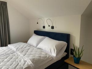 Postel nebo postele na pokoji v ubytování Manca Loft & SPA