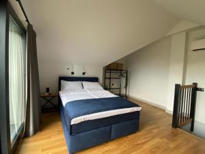 Postel nebo postele na pokoji v ubytování Manca Loft & SPA