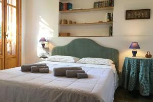 a bedroom with a bed with two pillows on it at Villa dei Pioppi in Fontane Bianche