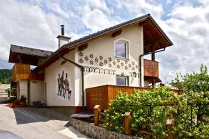 a house with stars on the side of it at Apartments Koledniki in Bled +60 photos