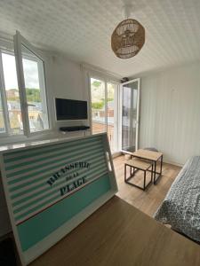 a room with a sign in the middle of a room at Détente en plein coeur du Tréport ! in Le Tréport