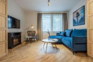 TV a/nebo společenská místnost v ubytování Smėlynas Boutique & SPA