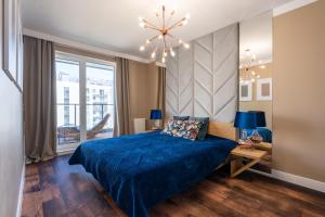 Posteľ alebo postele v izbe v ubytovaní Apartament Golden Rose