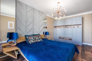 Posteľ alebo postele v izbe v ubytovaní Apartament Golden Rose