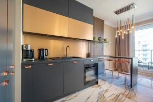 Kuchyňa alebo kuchynka v ubytovaní Apartament Golden Rose
