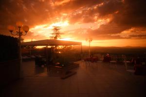 The sunrise or sunset as seen from a panziókat or nearby