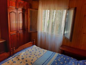 Postel nebo postele na pokoji v ubytování Apartmani MK-Vila MK