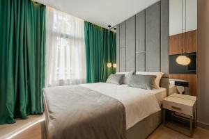 Posteľ alebo postele v izbe v ubytovaní Caldo Luxury Rooms