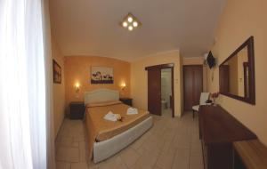 Uma cama ou camas num quarto em Vignali Residence