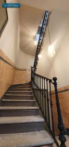 a spiral staircase in a building with a ceiling at B&B La Corte Antica - Luino Lago Maggiore in Luino