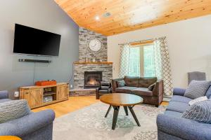 a living room with a tv and a fireplace at Bear Village 14 in Bartlett