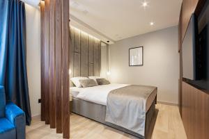 Posteľ alebo postele v izbe v ubytovaní Caldo Luxury Rooms
