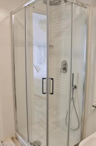 a shower with a glass door in a bathroom at Cetara Costa d'Amalfi Residence in Cetara