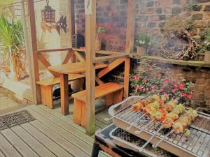 a grill with fruit on it on a patio at Embassie Backpackers in Liverpool