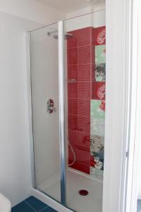 a shower with a glass door in a bathroom at Cetara Costa d'Amalfi Residence in Cetara