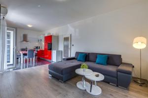a living room with a couch and a table at Apartment A & J in Petrcane