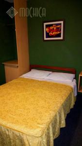 Letto o letti in una camera di Hostal Residencial Mochica