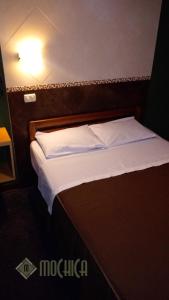 Letto o letti in una camera di Hostal Residencial Mochica