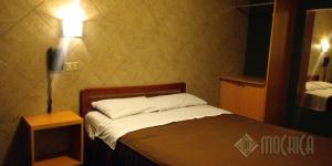 Letto o letti in una camera di Hostal Residencial Mochica