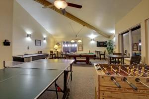 a large room with ping pong tables and ping pong tablesktop at Giant Steps 34 Ski In-out in Brian Head