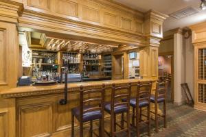 a bar with a row of bar stools at Cedar Breaks Lodge 3304 in Brian Head