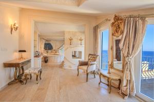 a living room with a desk and a room with a window at Lukka Exclusive Hotel – Adult Only +12 in Kaş