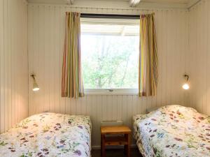 Postel nebo postele na pokoji v ubytování Holiday home Fanø LXXXIV