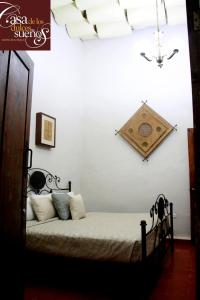 Postel nebo postele na pokoji v ubytování Casa de los Dulces Sueños