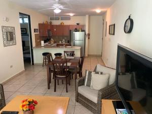 a living room with a kitchen and a dining room at Boqueron vacation in Boqueron