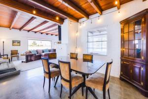 a dining room with a table and chairs and a couch at 4th Street in Tucson