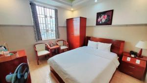 Postel nebo postele na pokoji v ubytování Thanh An Hotel