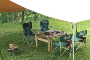 a group of chairs and a table under a tent at Guesthouse Coteau - Vacation STAY 5450 in Biei