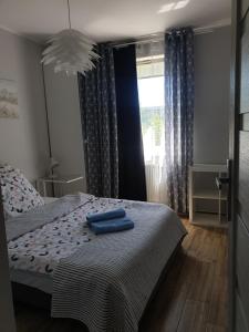 Posteľ alebo postele v izbe v ubytovaní Apartament Calamo Tuwima Park