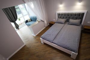 מיטה או מיטות בחדר ב-Apartments OCHERET