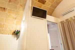TV a/nebo společenská místnost v ubytování B&B Nel Blu Dipinto Di Blu