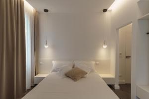 Postel nebo postele na pokoji v ubytování B&B Nel Blu Dipinto Di Blu