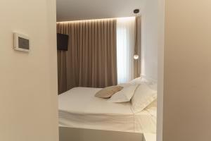 Postel nebo postele na pokoji v ubytování B&B Nel Blu Dipinto Di Blu