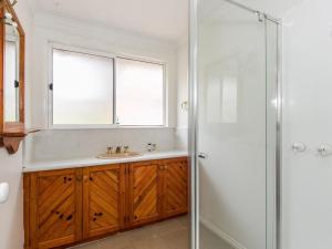 a bathroom with a sink and a shower at Sunset Strip 4 in Torquay +2 photos